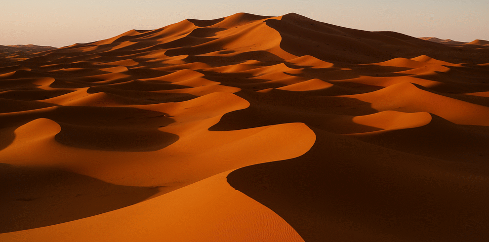 Small group tours of Morocco – Travelers exploring Sahara dunes, Marrakech, Fes, and the Blue City of Chefchaouen